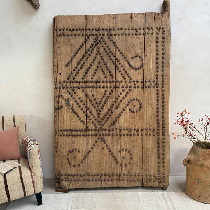 Decorative wooden panel with geometric pattern in a room setting