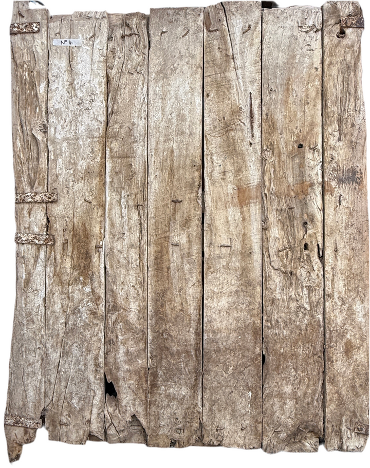Rustic wooden panel with a weathered texture on a white background