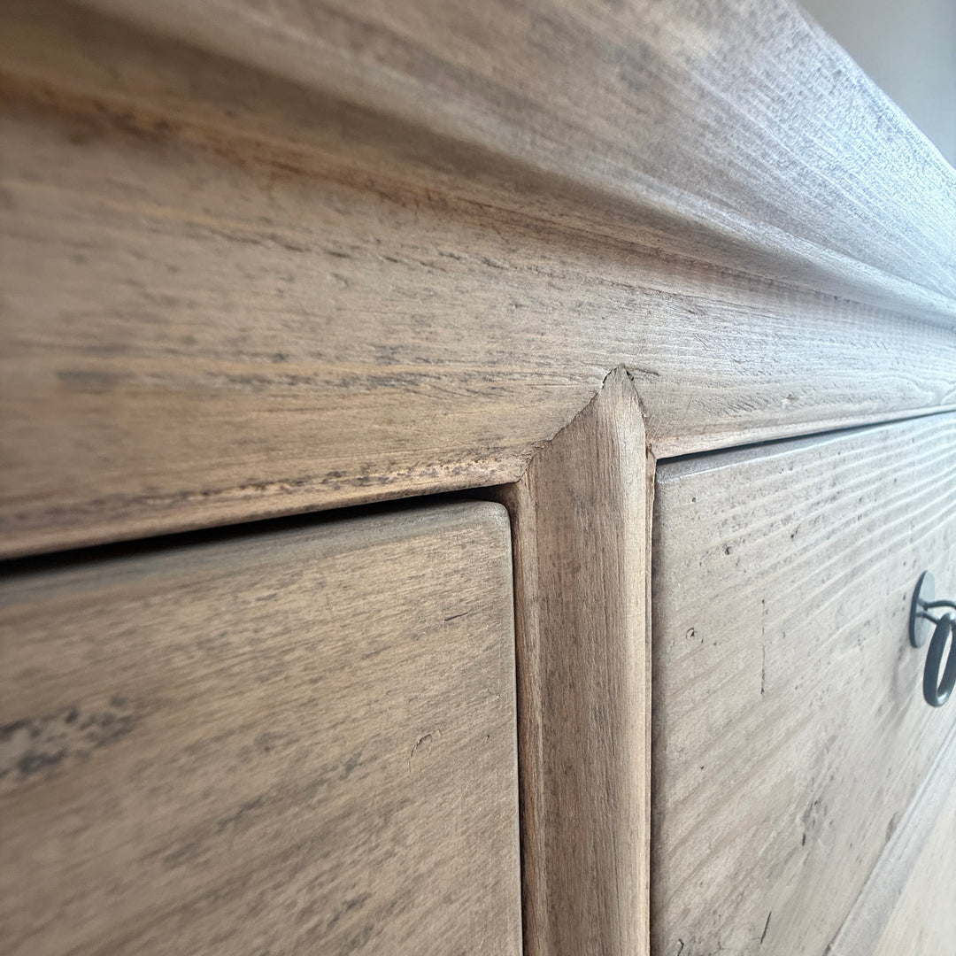 Close-up of wooden furniture with a focus on the grain and texture.