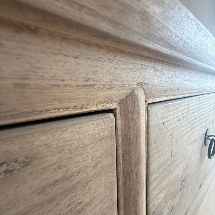 Close-up of wooden furniture with a focus on the grain and texture.