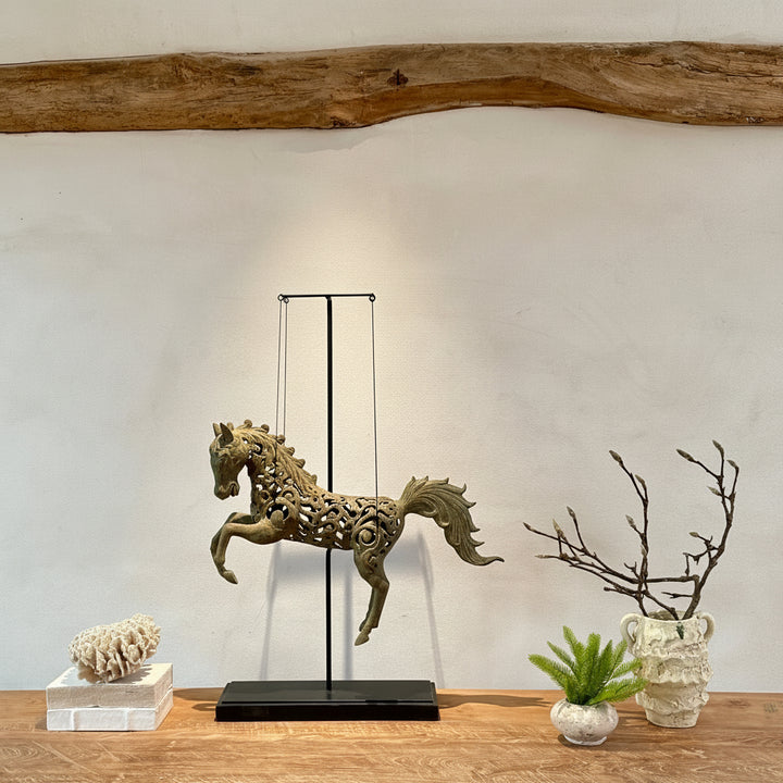 Large suspended bronze horse on stand