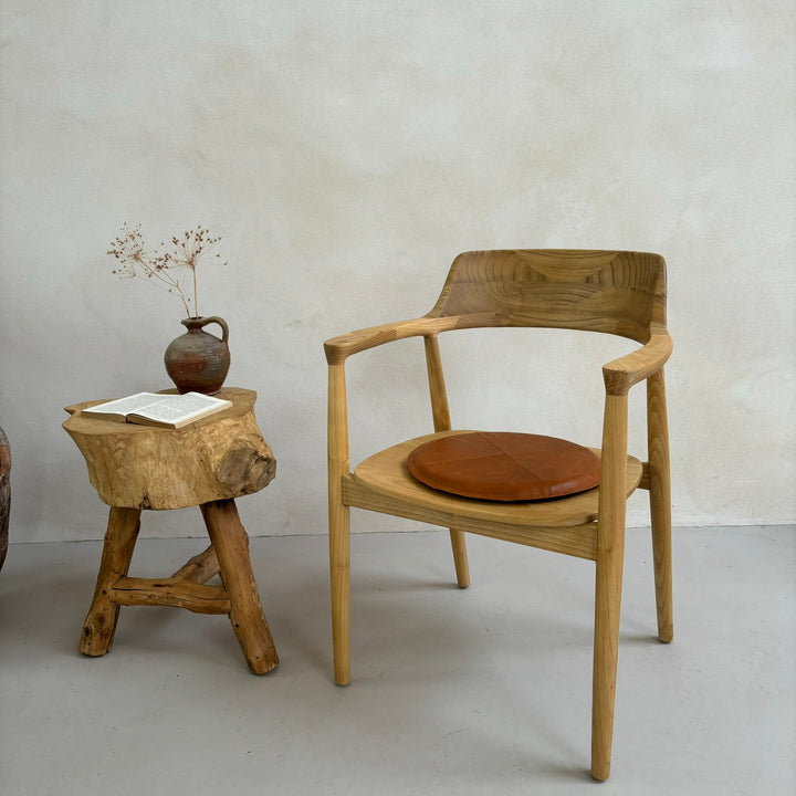 Leather Seat Pad styled on our Hoxton chair next to a tree stump side table