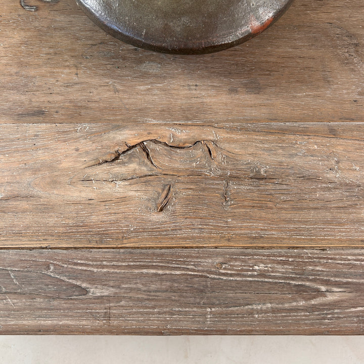 Detailed view of the reclaimed elm surface revealing natural knots, historic markings and the rich texture that makes every coffee table one of a kind.