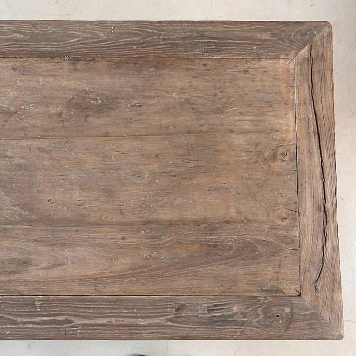 Close-up of the reclaimed elm tabletop displaying beautiful grain patterns, subtle colour variation and the authentic character developed over decades of use.