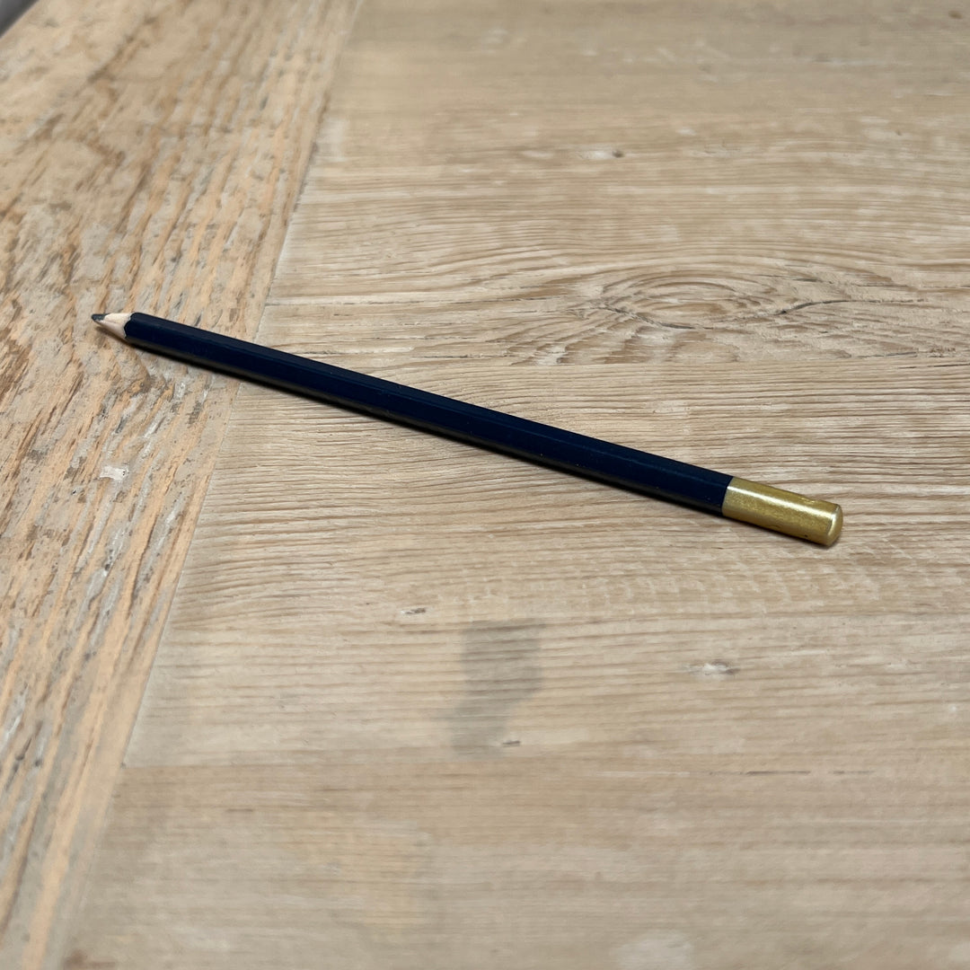 Characterful reclaimed pine dining tabletop showing natural markings and variations in the solid timber