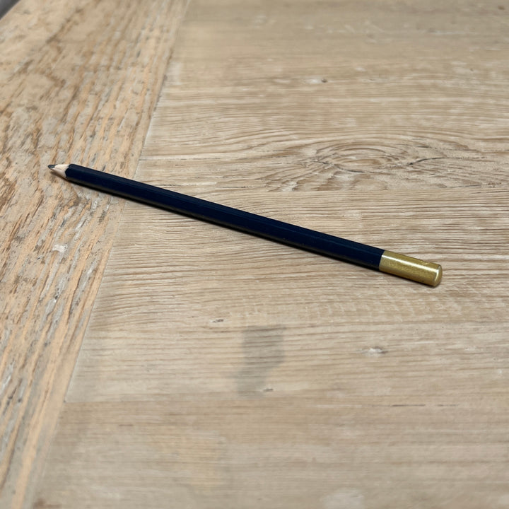 Characterful reclaimed pine dining tabletop showing natural markings and variations in the solid timber