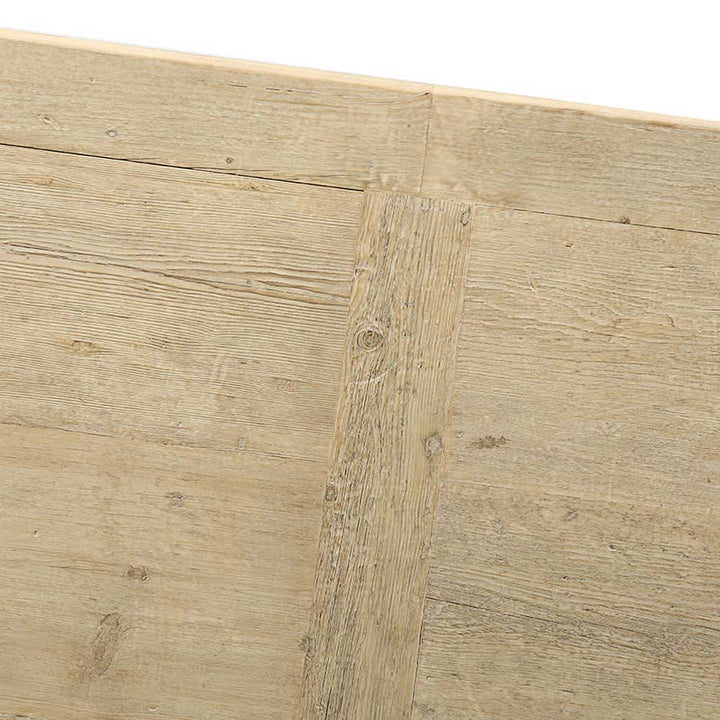 Close up of reclaimed pine dining table showing framed tabletop construction and naturally aged timber grain
