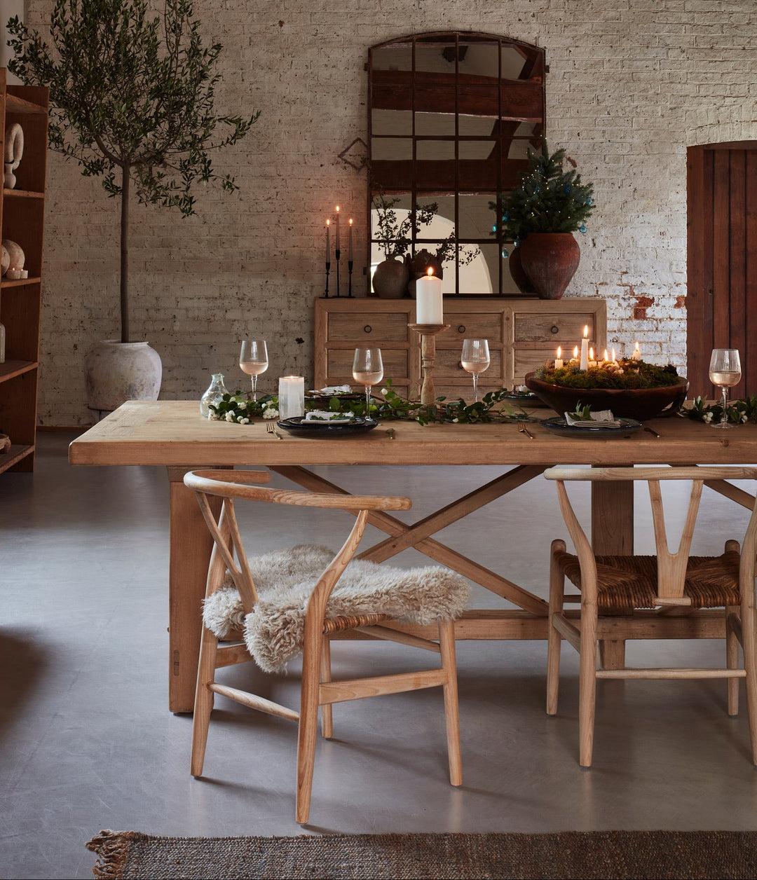 Natural patina and tonal variation across the characterful reclaimed pine dining tabletop