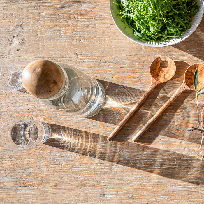 Close up of reclaimed pine dining table showing natural grain texture and historic timber markings