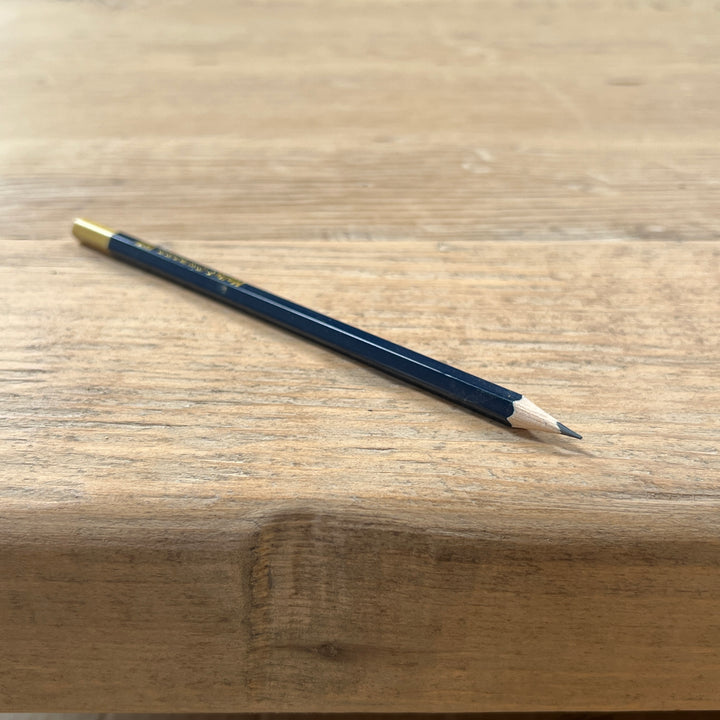 Natural historic markings and individual grain visible in the reclaimed pine dining table surface