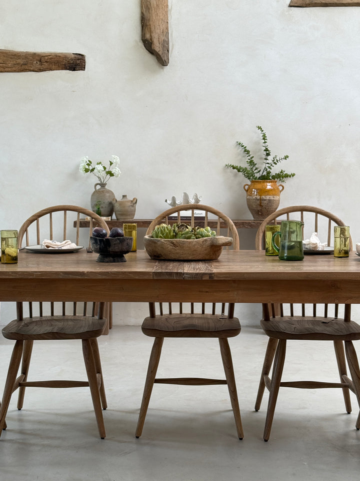 Front elevation of the reclaimed wood dining table highlighting its balanced proportions, handcrafted trestle base and the timeless beauty of reclaimed teak.

