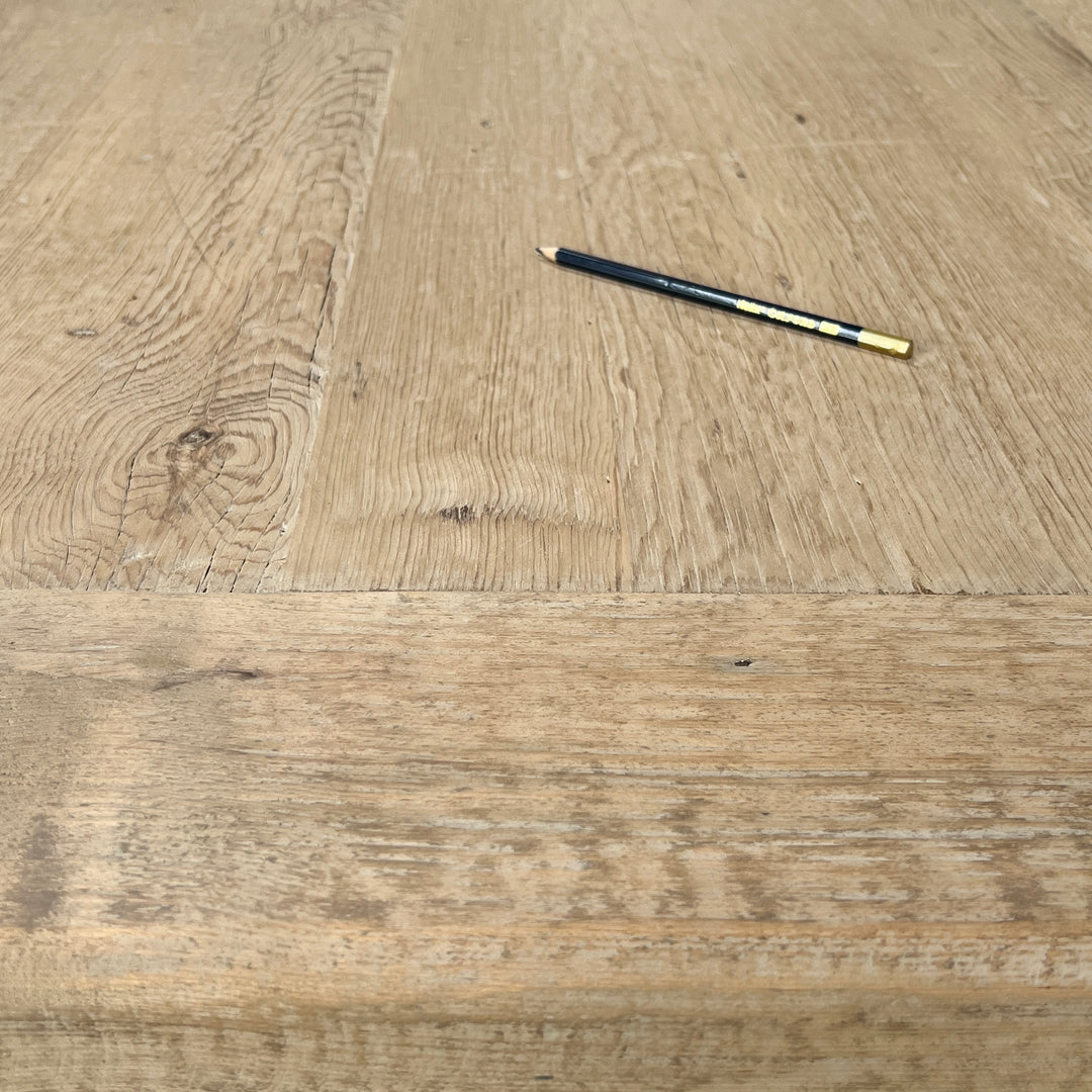 Detailed reclaimed wood dining tabletop showing distinctive grain and character from the timber&