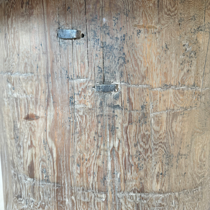 Close-up of a wooden door with visible grain and texture