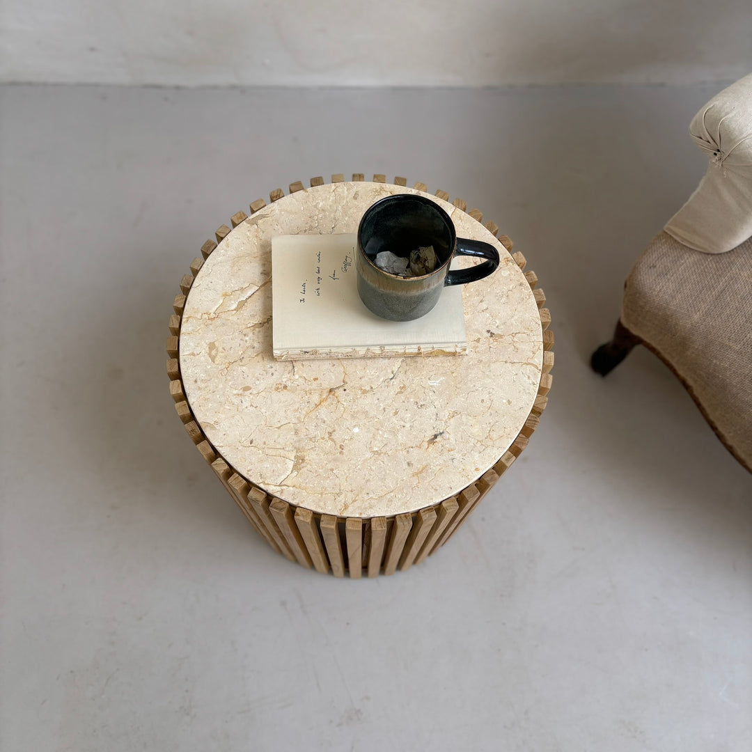 Slatted round marble topped side table top detail