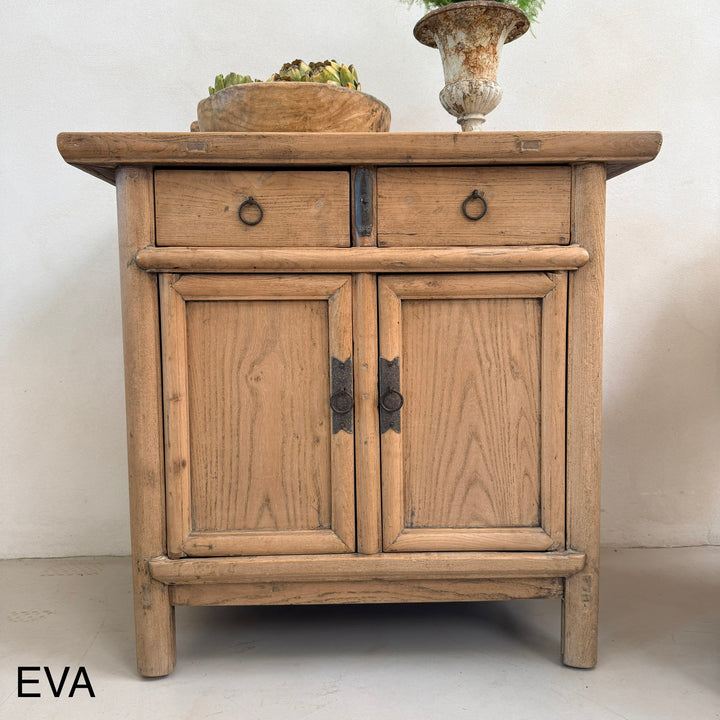 Wooden cabinet with two doors and a drawer on a white background
