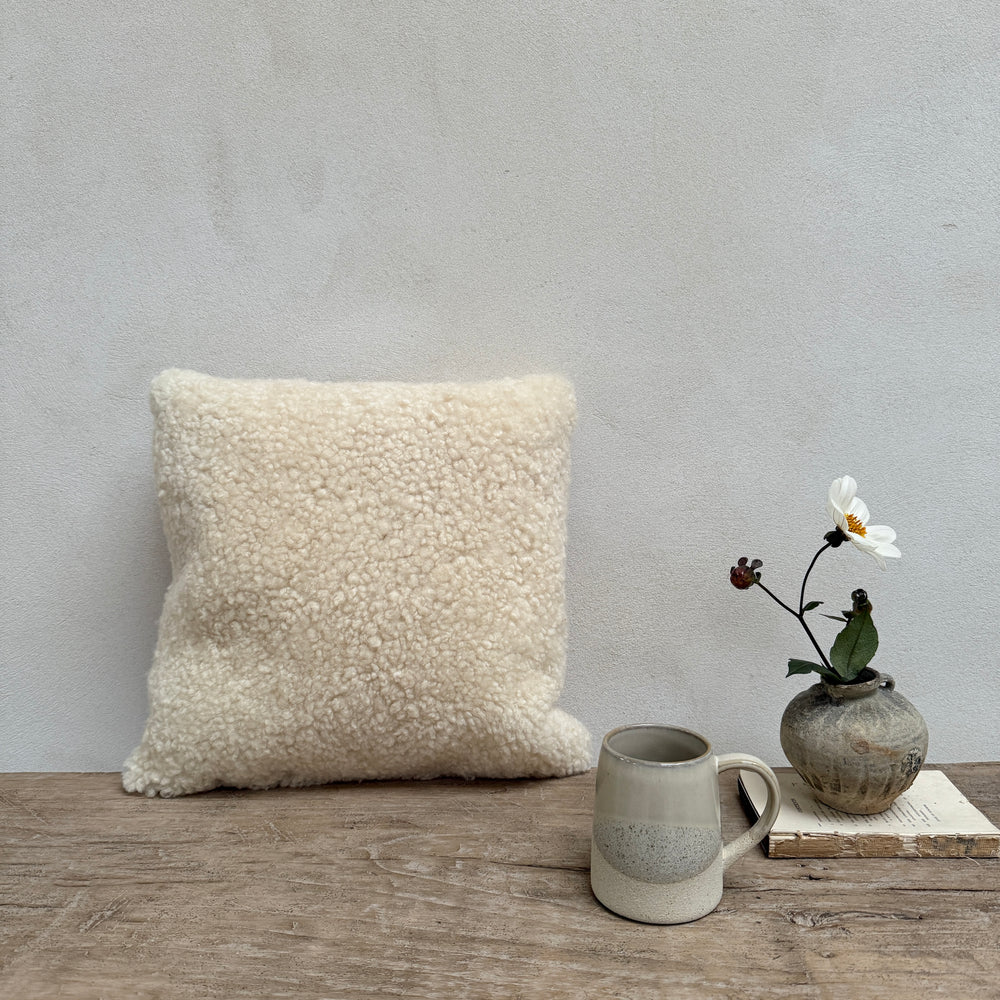 Square sheepskin cushion neutral