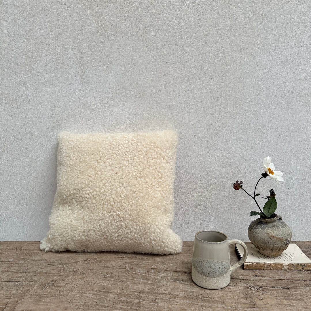 Square sheepskin cushion neutral