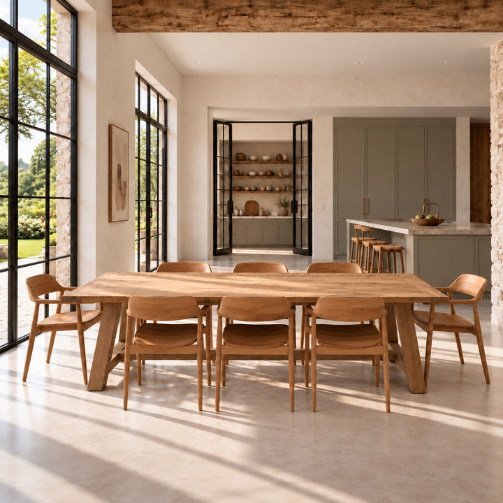 Large Suffolk reclaimed oak dining table styled with eight chairs in a contemporary country home