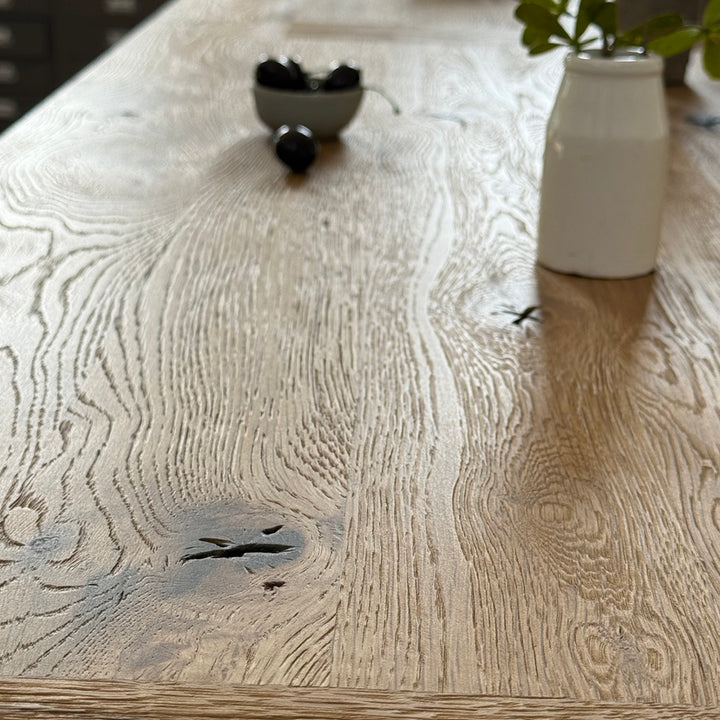 Suffolk solid oak dining table showing characterful reclaimed timber in natural light