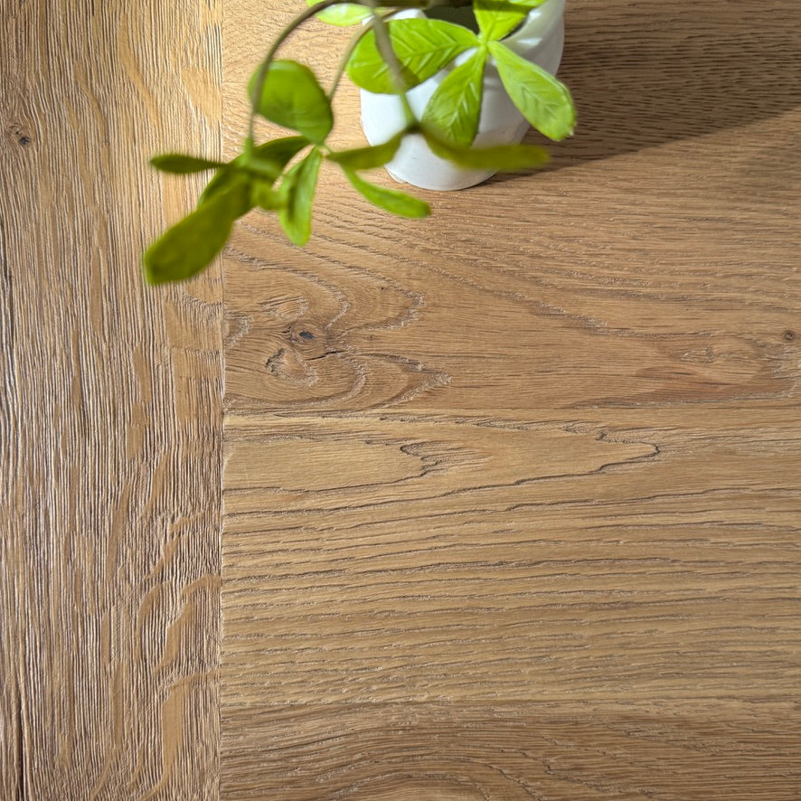 Reclaimed oak boards on the Suffolk dining table showing natural grain and tonal variation