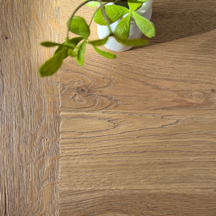 Reclaimed oak boards on the Suffolk dining table showing natural grain and tonal variation