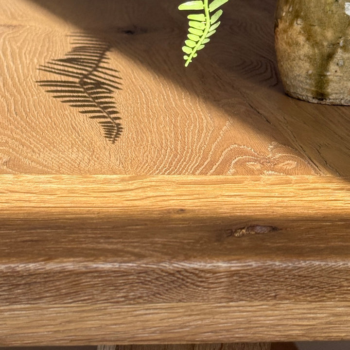 Close up of the Suffolk dining table edge showing the tactile texture of solid reclaimed oak