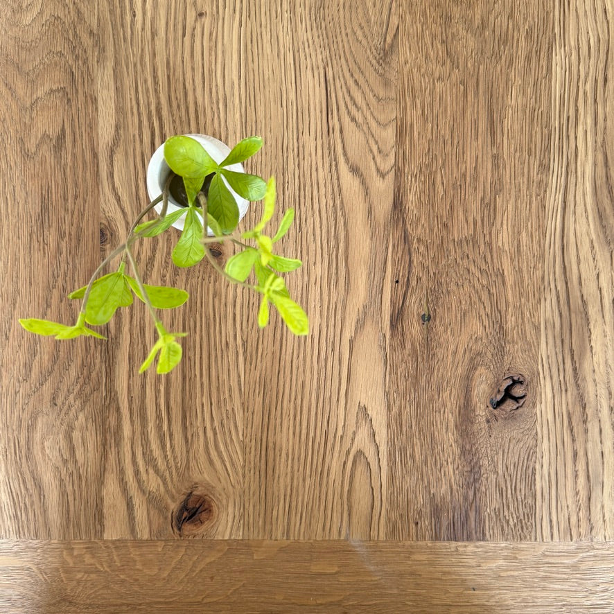 Natural oak grain and characterful knots on the Suffolk reclaimed oak dining table