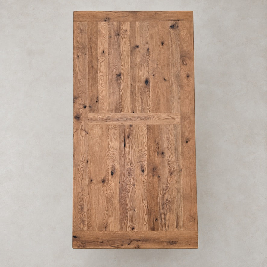Overhead view of the Suffolk dining table showing reclaimed oak boards and natural timber character