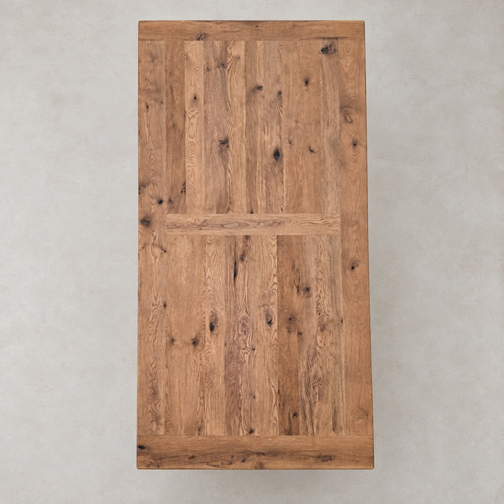 Overhead view of the Suffolk dining table showing reclaimed oak boards and natural timber character