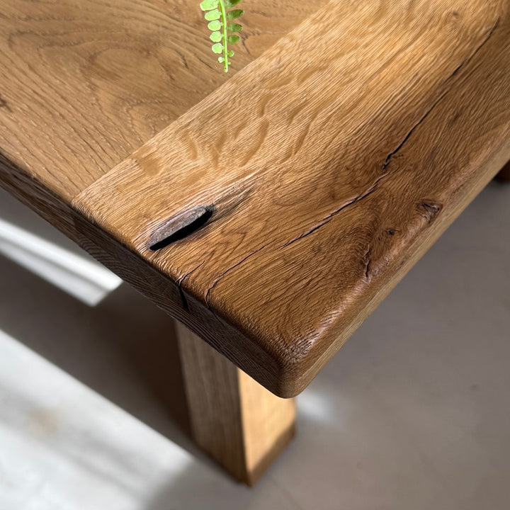 Corner detail of the Suffolk rustic oak dining table showing authentic reclaimed timber character