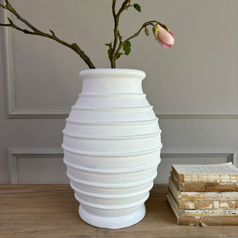 White terracotta ribbed vase close up detail