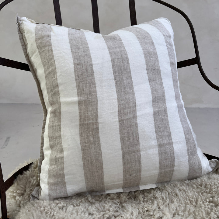 Wide stripe linen cushion close up on chair