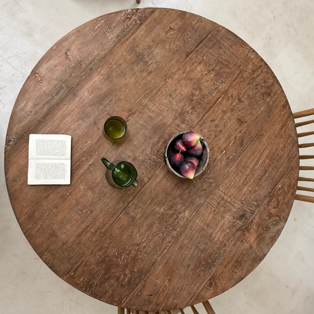 Overhead view of the York reclaimed teak round dining table showcasing the beautiful weathered grain, historic markings and authentic reclaimed timber character.