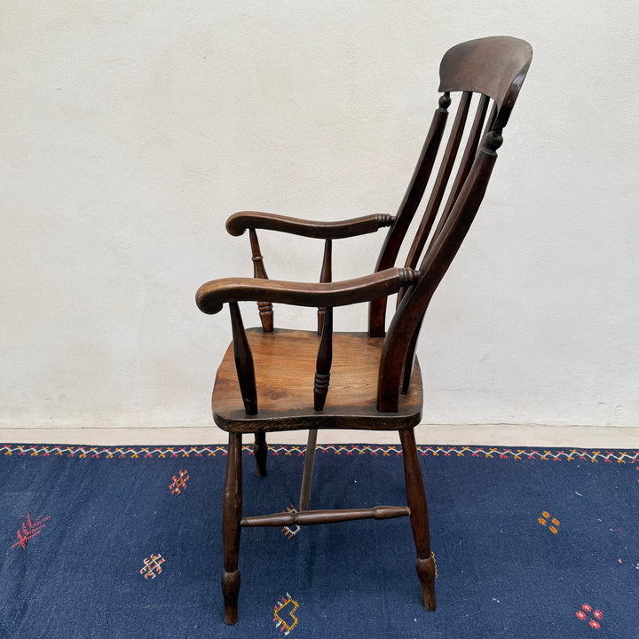 Side profile of the Antique Victorian Elm Windsor Chair Harry showing its elegant proportions and traditional construction.
