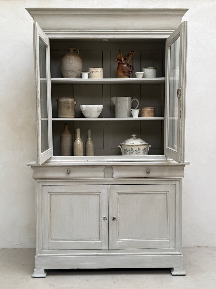Antique French painted oak Buffet Deux Corps with glazed doors open showing display shelving and storage.
