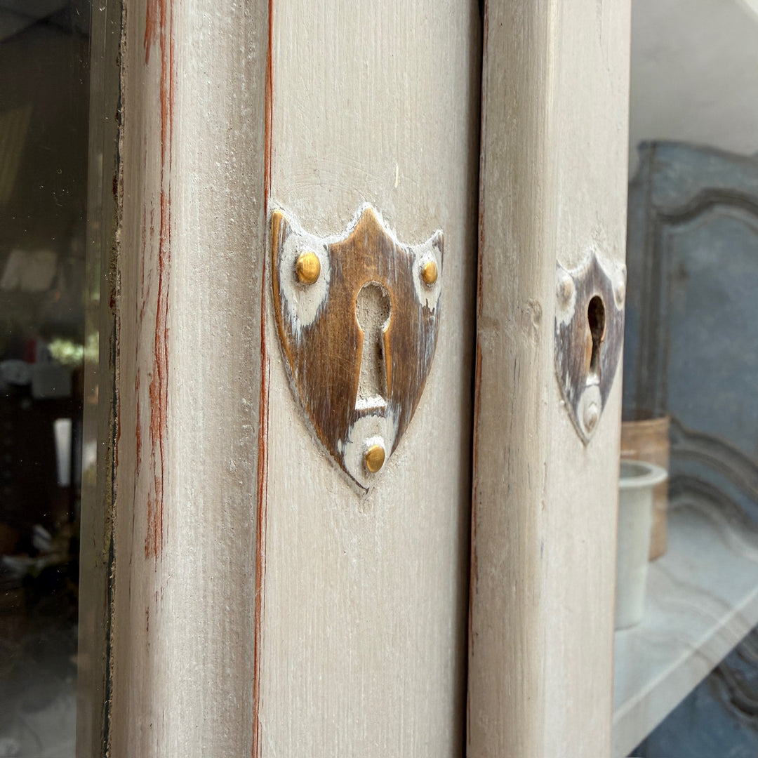 Original decorative escutcheon and lock detail on the antique French Buffet Deux Corps.
