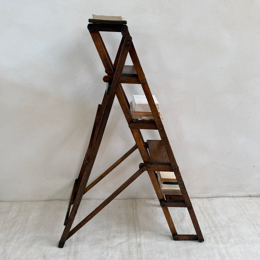 Side profile of the Antique English Library Ladder Margot highlighting its collapsible construction.

