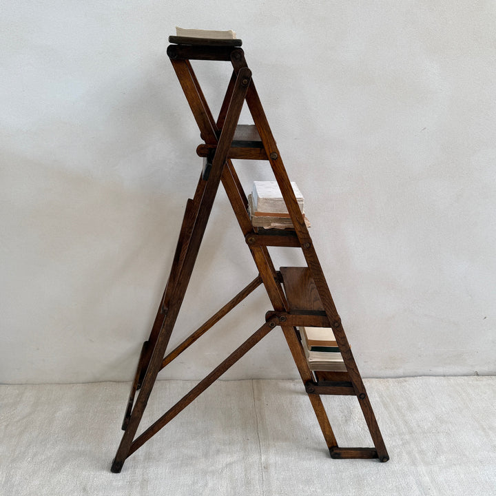 Side profile of the Antique English Library Ladder Margot highlighting its collapsible construction.

