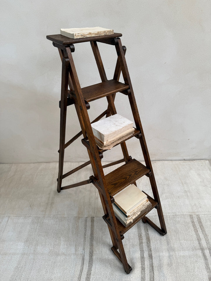 Three-quarter view of the Antique English Library Ladder Margot showing its classic English design.
