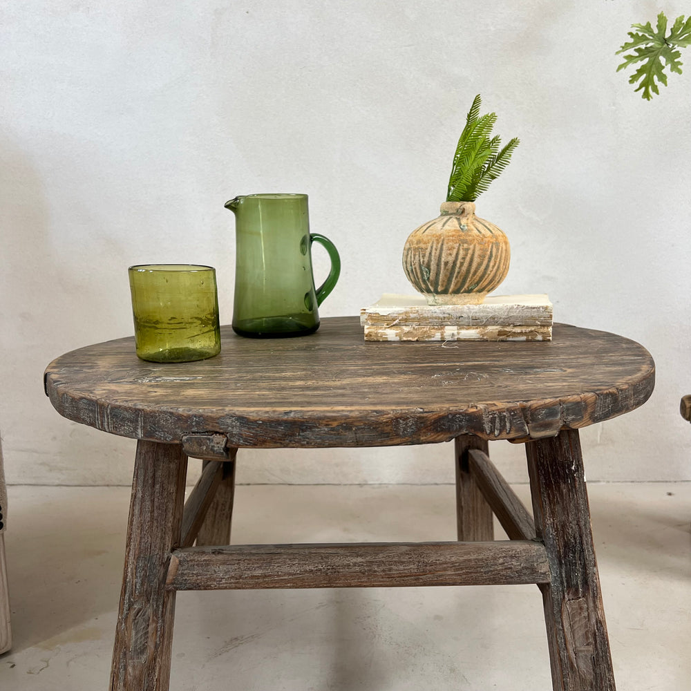 Antique Round Elm Side Table Morgana handcrafted from aged solid elm with a weathered round tabletop.