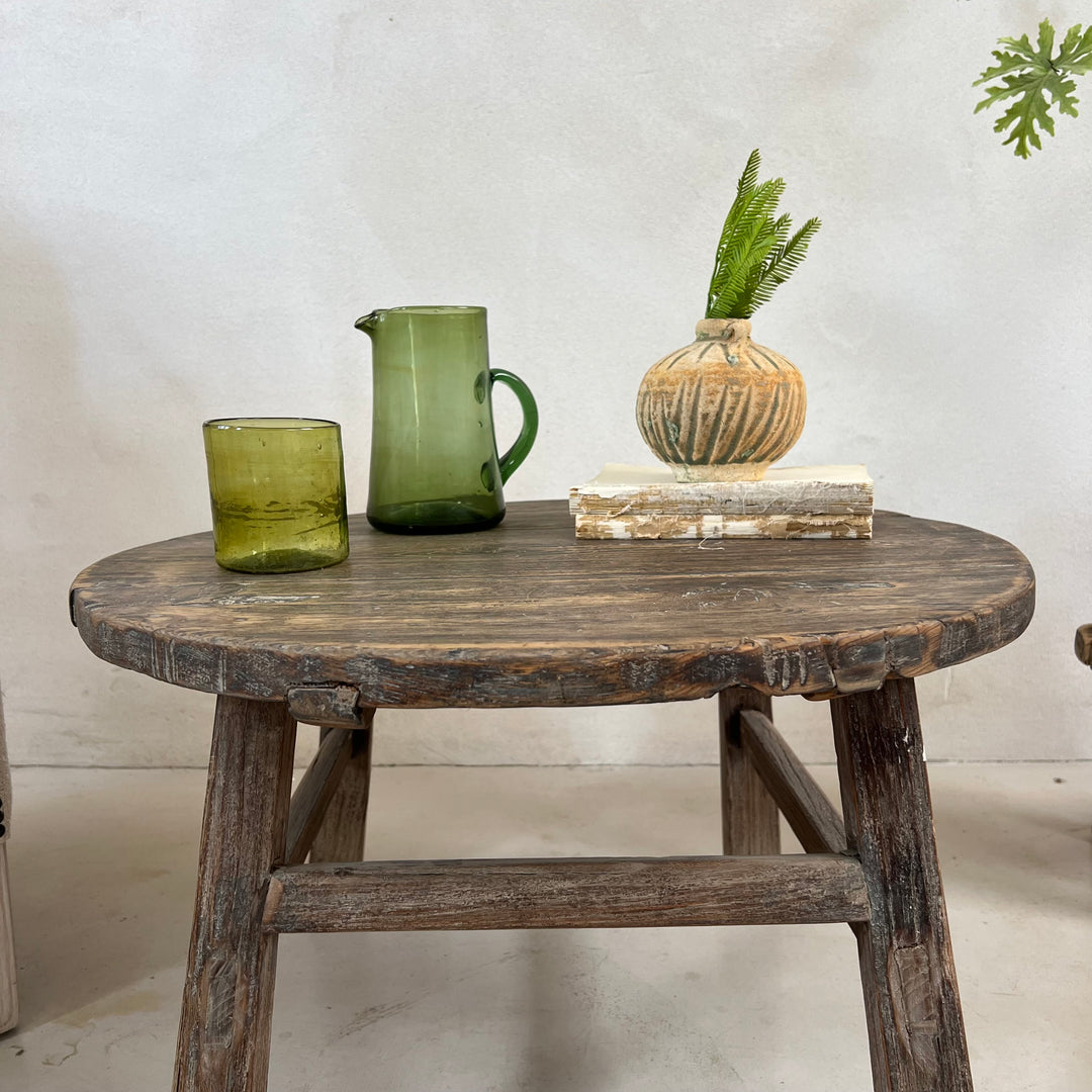 Antique Round Elm Side Table Morgana handcrafted from aged solid elm with a weathered round tabletop.