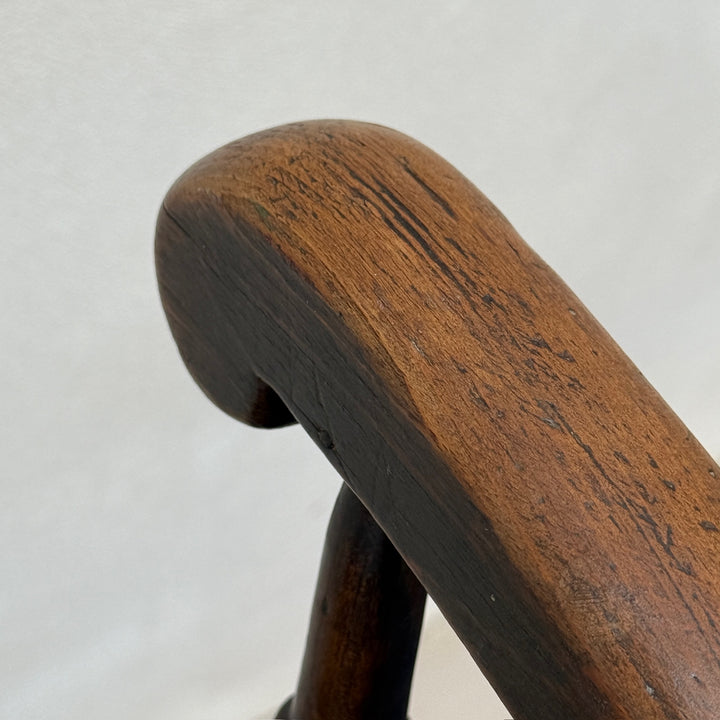 Detail of the aged timber, softened edges and beautiful patina on the crest rail of the Antique Victorian Windsor chair Harry.
