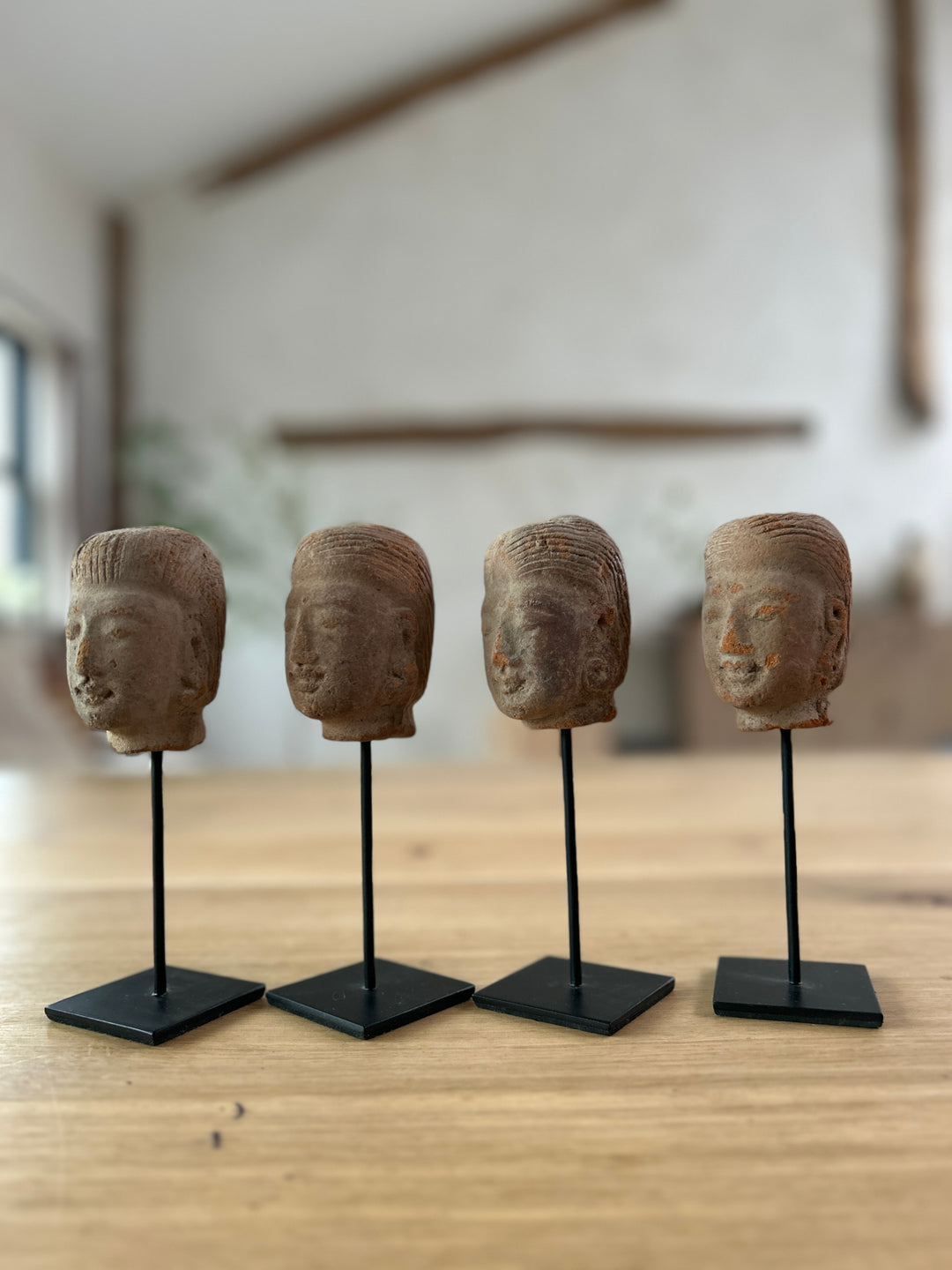 hand-carved antique terracotta heads on stand | Sita