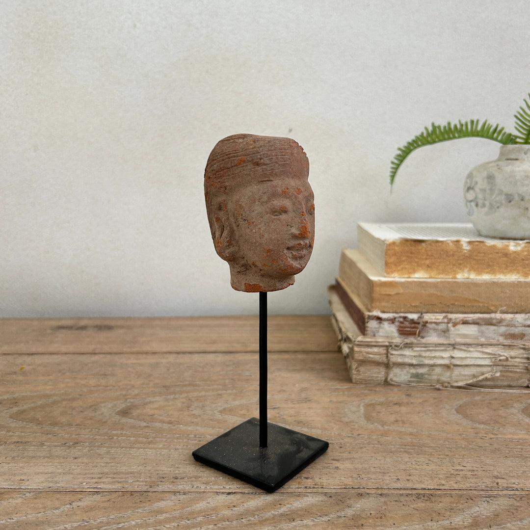 hand-carved antique terracotta heads on stand | Sita
