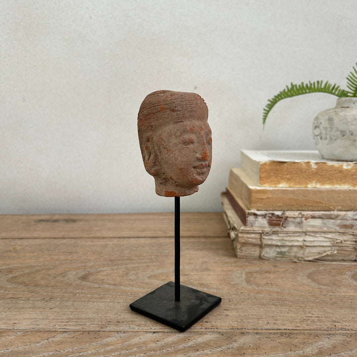 hand-carved antique terracotta heads on stand | Sita