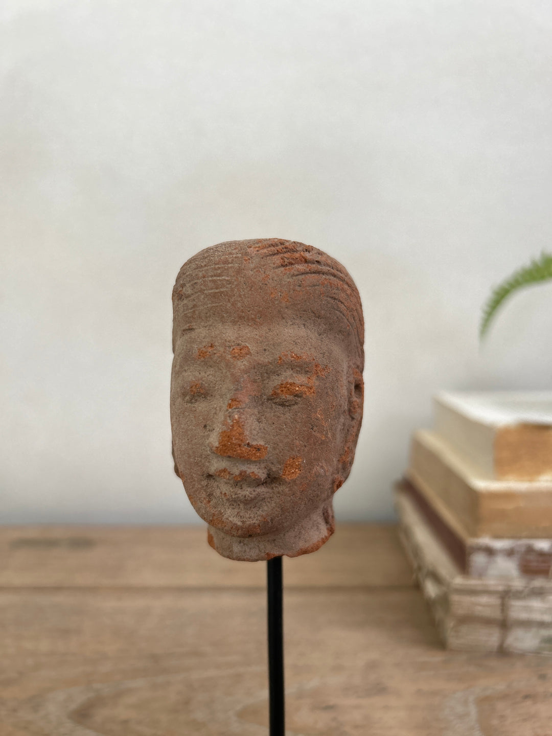 hand-carved antique terracotta heads on stand | Sita
