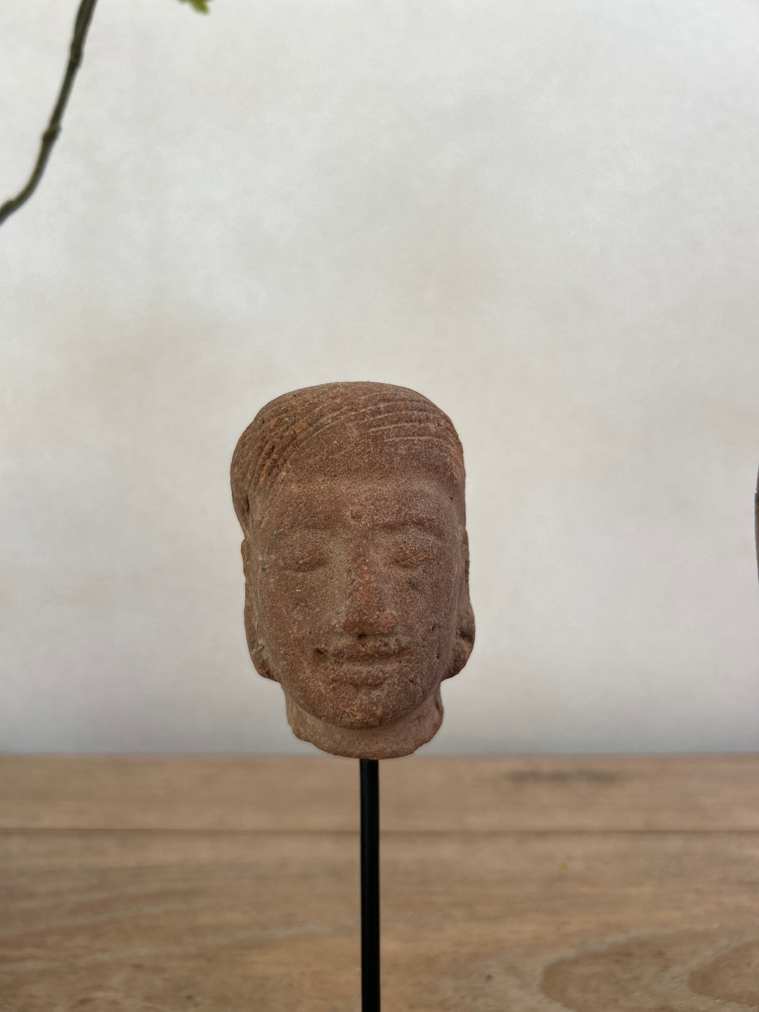 hand-carved antique terracotta heads on stand | Sita