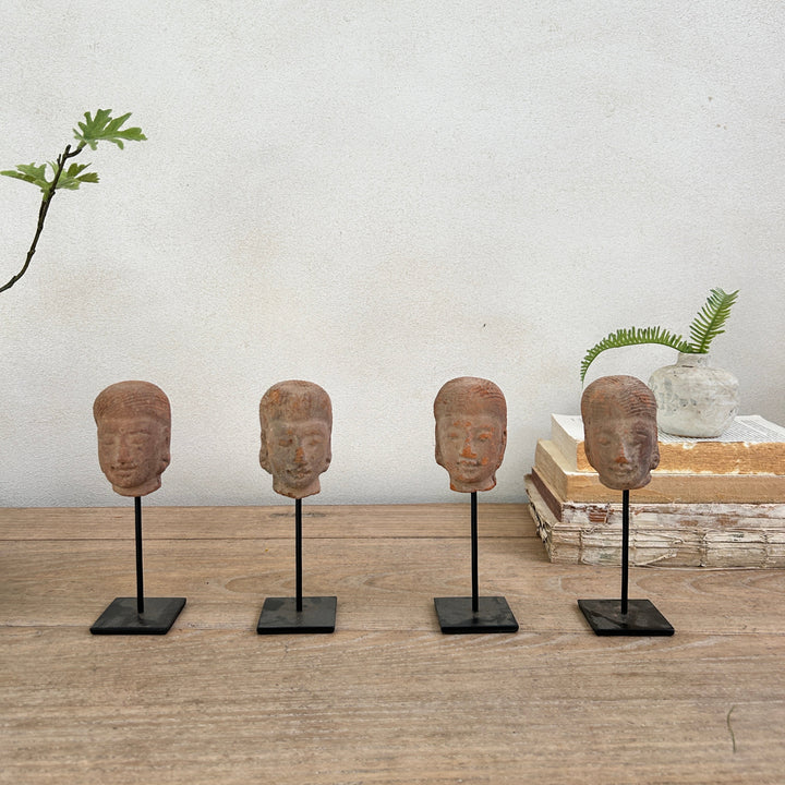 hand-carved antique terracotta heads on stand | Sita