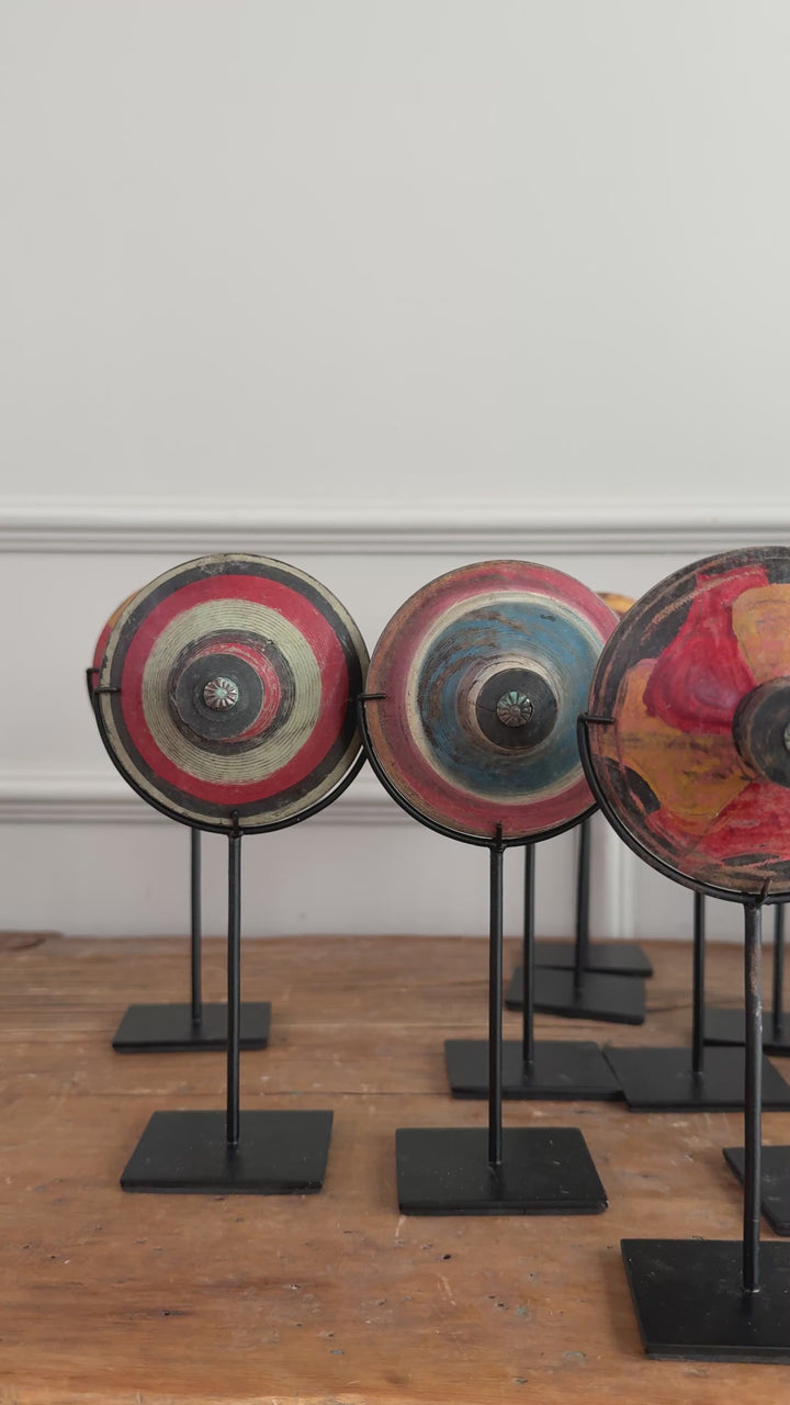 Antique small spinning top on stand