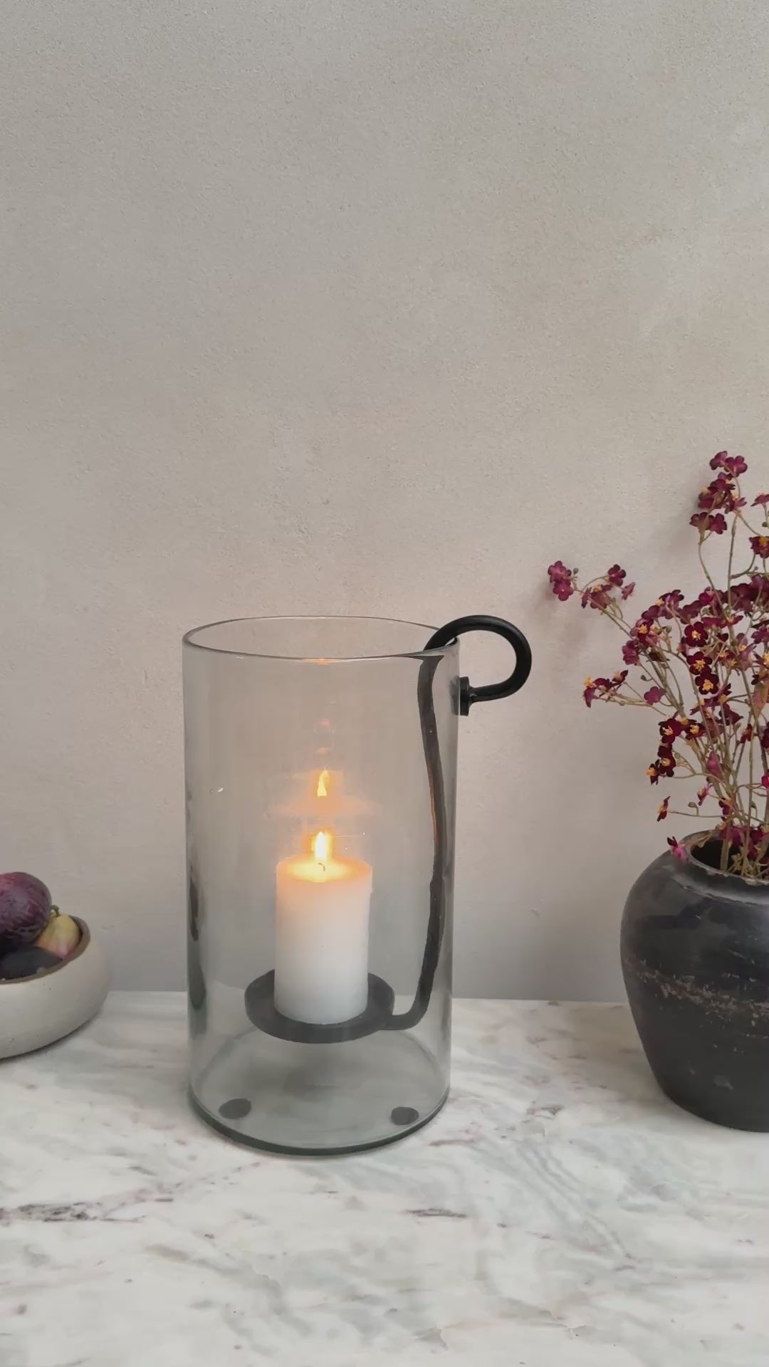 Glass hurricane lantern and candle holder